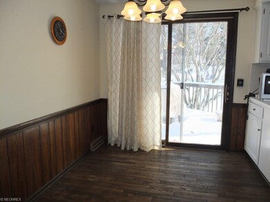 Dinette with hardwood floor.