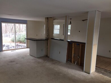 Living room and back of kitchen cabinets