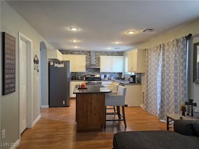 Kitchen with large movable island, stainless steel