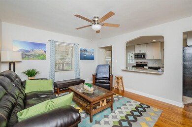 Living room with real hardwood flooring! Open to r