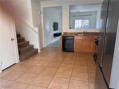 Kitchen featuring light tile patterned flooring, a