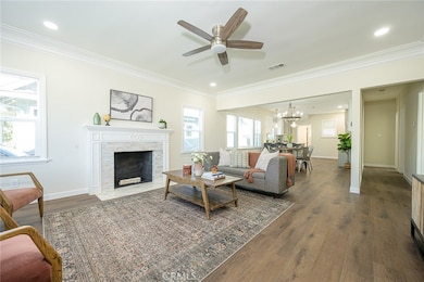 Open living area with decorative fireplace and new luxury flooring
