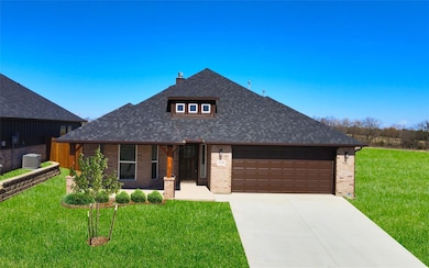 View of front of property with an attached garage,
