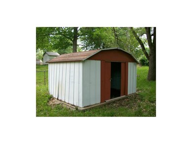 Out buildling showing sliding doors