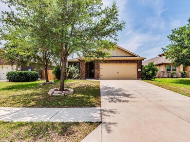 View of front of property with brick siding, an a