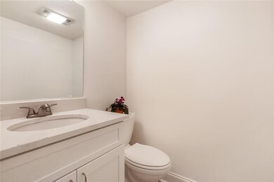 1/2 bath updated with new wood cabinetry, new unde