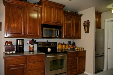 Custom Cabinets, Built-In Microwave, Newer Stainless Steel Range and Oven