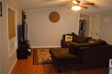 Living room is open to kitchen and dining room.