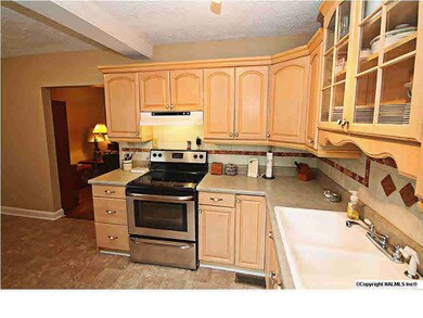 THE KITCHEN HAS BEEN UPDATED WITH NEW CABINETRY, COUNTERS...