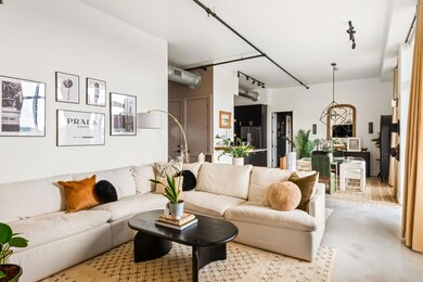 Living area featuring finished concrete flooring 