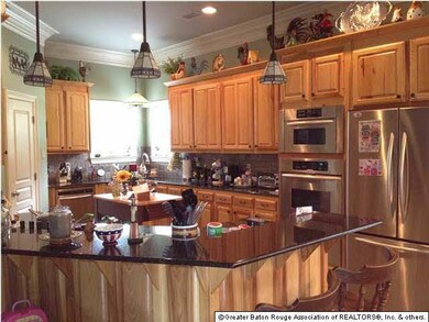 Another view of kitchen with breakfast bar