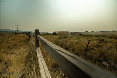 Northern property line with split log fence.