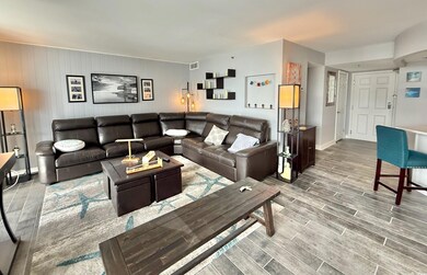 Living room with wood finished floors and baseboar