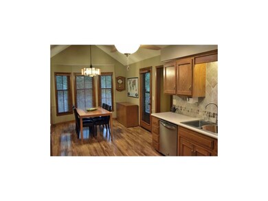 Large, open kitchen with wood floors