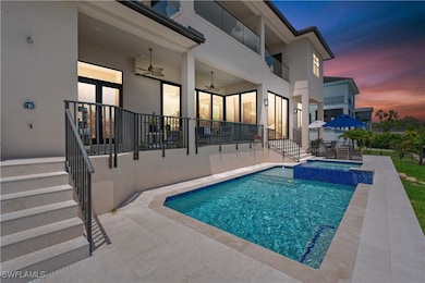 View of pool featuring a patio area, ceiling fan,