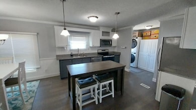 Kitchen with appliances with stainless steel finis