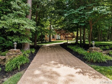 Private Aggregated Driveway leads to Beautiful Tra