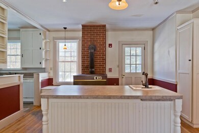 Kitchen with center island and door...