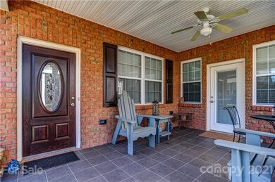 Covered porch with brick front, and fan!