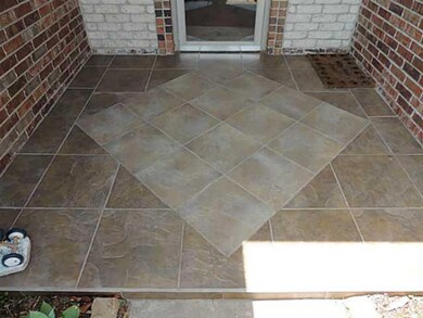 Exterior Front. Tiled front porch