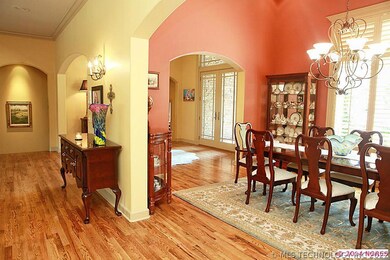 Formal dining room features a very tall grand ceil