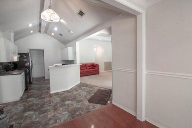 Breakfast bar in kitchen open to living area.