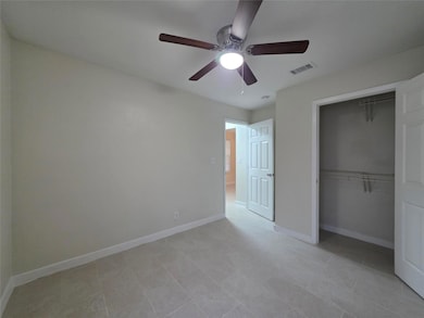 Unfurnished bedroom featuring a closet, baseboard
