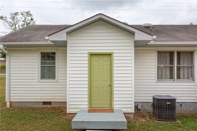 REAR ATTACHED STORAGE OR POSSIBLE ADDITION IF FINI