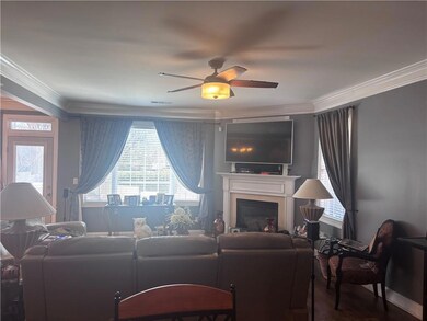 Living room featuring a wealth of natural light, c