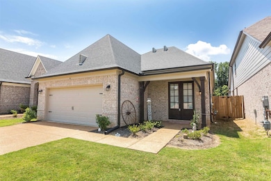 View of front of property featuring a garage and a