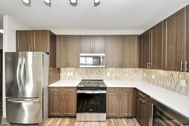 Photos are not of actual units, similar floor plan finishes, verify dimensions