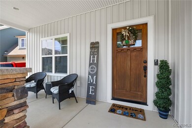 Spacious front porch with craftsman style door