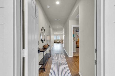Inviting entry hallway with wood-like vinyl floori