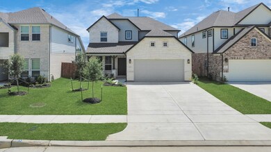 Home features a convenient 2-car garage complemented by a spacious driveway, offering ample parking for you and your guests.