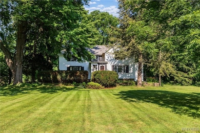 This home rests on a lovely, park-like yard.