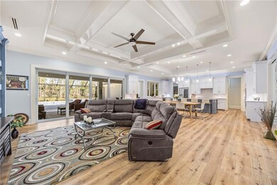 Great room with family area, formal dining and open kitchen.