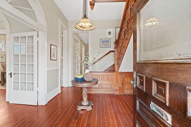 The gracious foyer introduces the home’s rich char