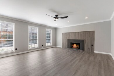 Large living room with gas fireplace.