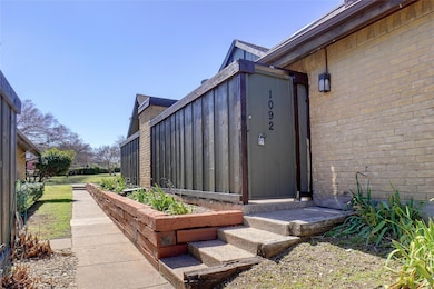 View of side of property with brick siding