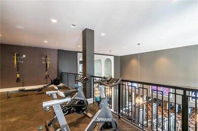 Exercise area with dark tile flooring