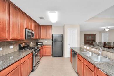 Gourmet kitchen will make any chef happy! Stainless Steel Gas Appliances, Granite counters and 42