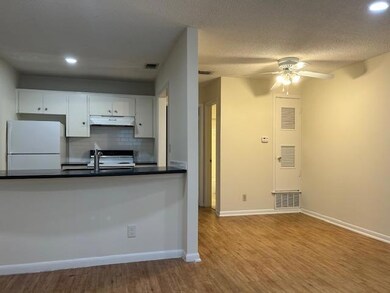Kitchen featuring visible vents, ceiling fan, dar