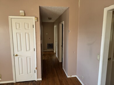Hallway to all bedrooms and two bathrooms.