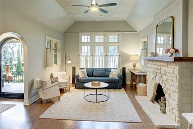 Vaulted Living Room with Stone Fireplace.