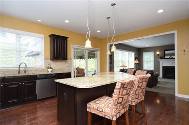 The kitchen opens into the family room. A sliding 