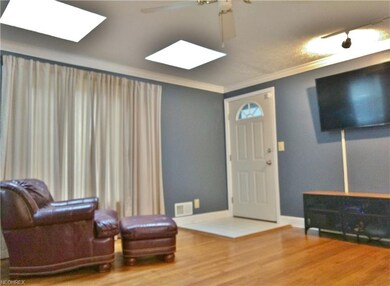 Great Room area with two skylights, ceiling fan an