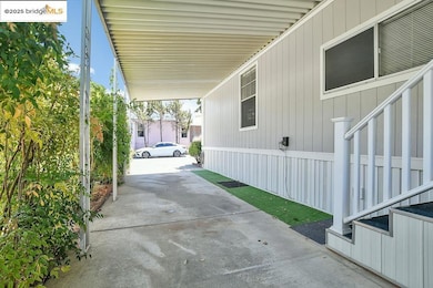 View of patio featuring an attached carport