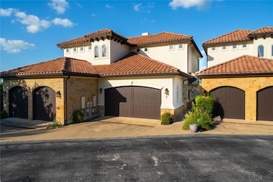 Mediterranean / spanish home with stone siding, a