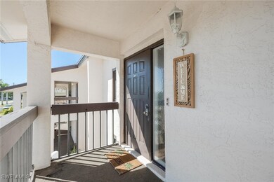Doorway to property with a balcony