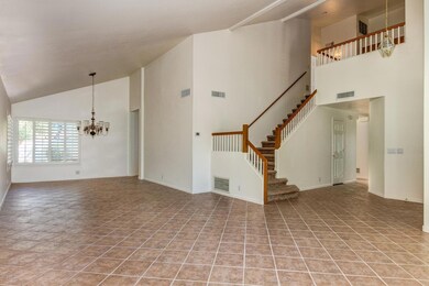 Open stairway leads to bedrooms.